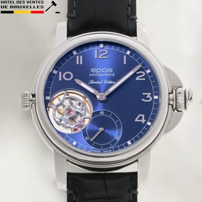 a close up of a wrist watch with a blue dial