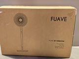 the box of a fan is sitting on the table
