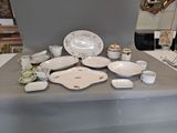 a table that has a lot of dishes and cups on it