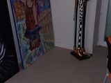 a room with paintings and sculptures on the walls