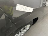 a sticker on the side of a car that has a sticker attached to it