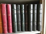 many books that are on a shelf in a book case