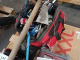 a pile of assorted items and tools on a pallet