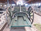 a wagon that is sitting in the middle of a barn