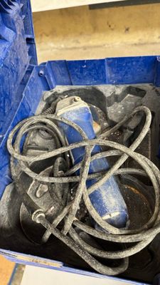 a blue box with a bunch of shoes inside of it