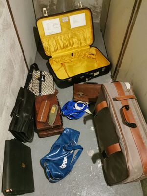 many pieces of luggage sitting on the floor next to each other