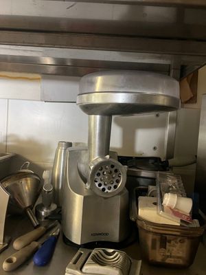 a kitchen counter with a blender and other kitchen utensils