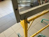 a cart that is sitting on the floor in a building