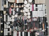 a lot of makeup and cosmetics products laid out on a table
