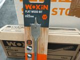 a box of wood and a pair of scissors on the floor