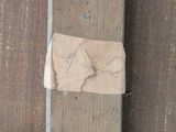 a piece of paper that has been taped to a wooden wall