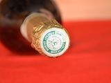 a close up of a bottle of wine on a table
