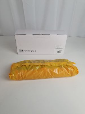 an orange plastic bag sitting on top of a table next to a white box