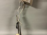 a close up of a metal object with wires attached to it