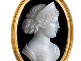 a close up of a picture of a woman ' s head in a gold frame