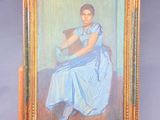 an oil painting of a woman in a blue dress sitting on a wooden easel