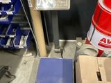 a red fire hydrant sitting next to a box of blue boxes