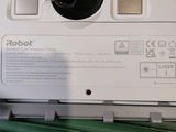 a close up of a printer with a green cord