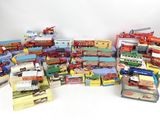 many different types of toy trains and trucks on the table