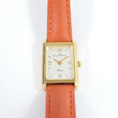 an image of a close up of a wrist watch on a white surface