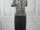 a dress on a mannequin stand in a room