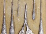 a lot of silver items that are on the table