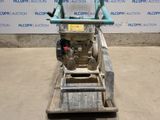 a close up of a machine on a dolly in a warehouse