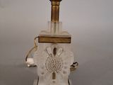 an image of a glass lamp with a gold base and a white base