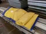 a yellow bag sitting on top of a conveyor belt