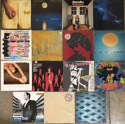 a lot of records on the floor of this room