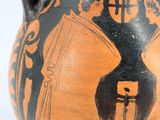 a black and orange vase with a painting on it