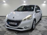 the small white car is parked in a large room