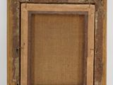 an old wooden picture frame with a burlock canvas backing it