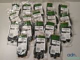 a lot of bags of green and black gloves on a table