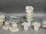 a lot of glass vases that are sitting on a table