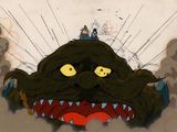 illustration d'animation représentant un monstre avec un homme perché sur sa tête