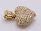 an image of a gold and diamond heart pendant on a white background