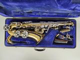 a saxophone inside of a blue case on a white surface