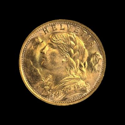 gros plan d'une pièce d'or sur fond noir