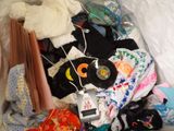 a pile of clothes and other items in a plastic bag
