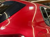 a red car that is parked in a garage