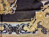 versa versa versa scarf with gold and black design on it