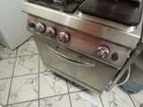 a stainless steel stove top with two burners on it