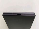 a close up of the back of a black cell phone