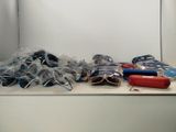 many items that are sitting on a shelf in a room