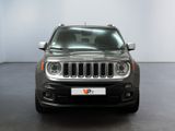 the front of a grey jeep is parked in a room