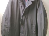jacket hanging on a hanger on a wall in a room