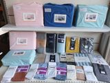 many different colored shirts on a shelf in a store