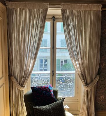 a chair that is sitting in front of a window