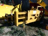 a yellow machine that is sitting in the grass